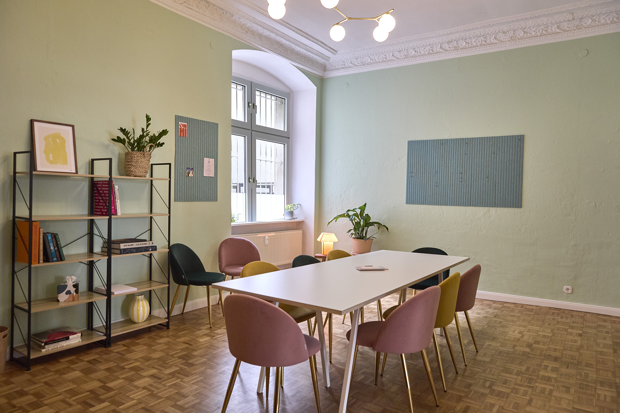 The Meeting Room — another angle, sage-green walls and velvet chairs