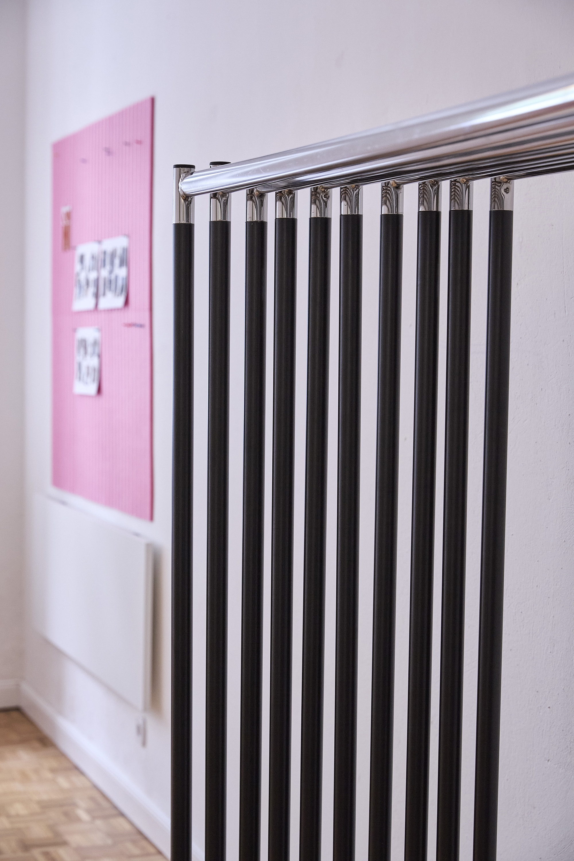 Chrome clothing rail detail with hangers